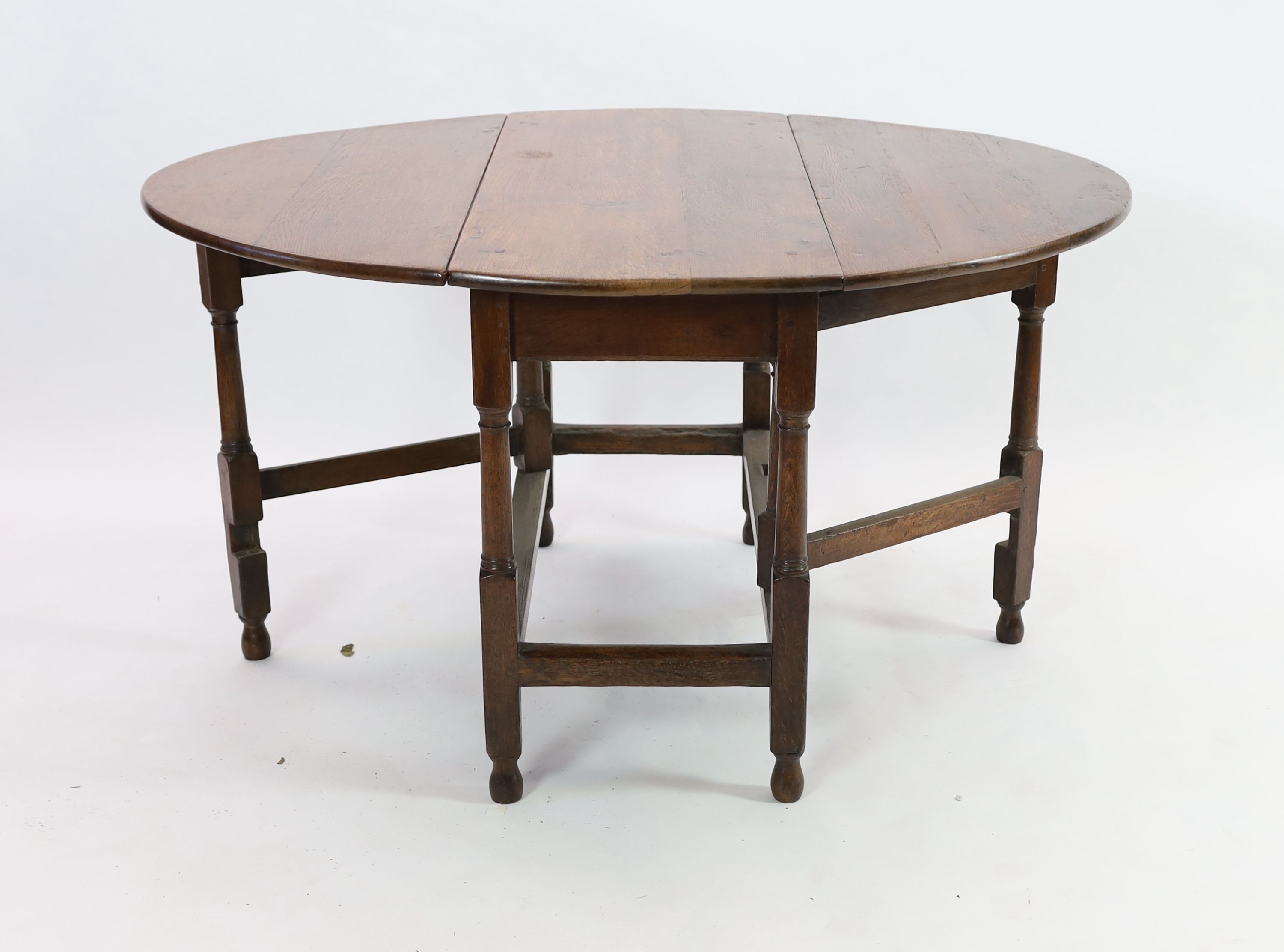 An 18th century oak gateleg dining table, 140cm extended, width 51cm height 75cm